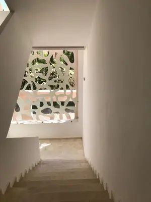 a room with a window with a painting on the wall at SUNNY 48- Appart Cozy -Marrakech-centre in Marrakech