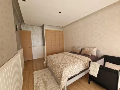 a small bedroom with a bed and a closet at Villa golf prestigia marrakech in Marrakech