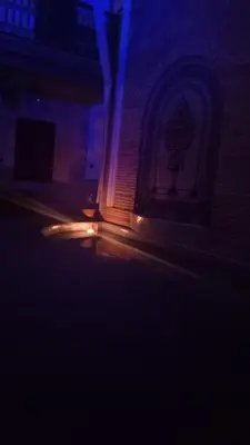 a blurry picture of a building in the dark at Riad Bonheur in Marrakech
