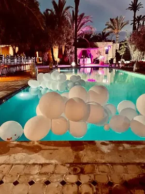a pool with a bunch of white balls on it at Hôtel Dar 55 - Berber House - Boutique Hôtel in Marrakech