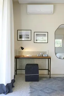 a desk in a room with a mirror and a chair at Villa Dar Challa in Marrakech