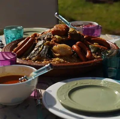 a table with a plate of food on a table at Beldicolors in Marrakech