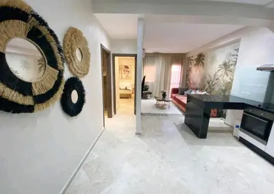 a living room with a large mirror and a television at The Best location to visit Marrakech Carré Eden a little Walk to the Médina in Marrakech
