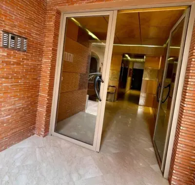 a large glass door in a brick building at The Best location to visit Marrakech Carré Eden a little Walk to the Médina in Marrakech