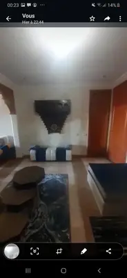 a view of a living room with a tv at marrakech palmeraie village Etablissement jasmin in Marrakech