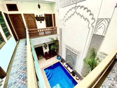 an aerial view of a house with a swimming pool at Riad Nouhal in Marrakech