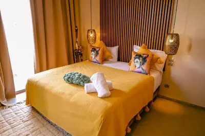 a bedroom with a bed with two dolls on it at Villa des sœurs bradaa in Marrakech
