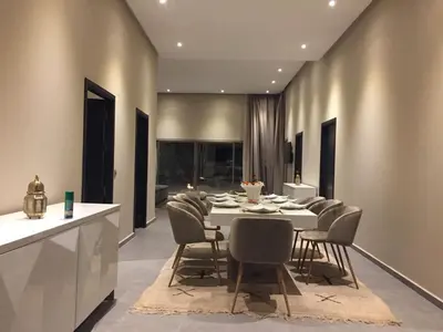 a dining room with a table and chairs at Villa Jamila -Villa de luxe a Marrakech in Marrakech