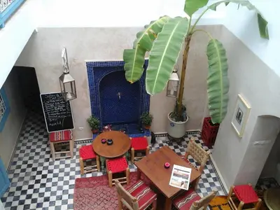 an overhead view of a restaurant with a table and chairs at Dar Daoud in Marrakech