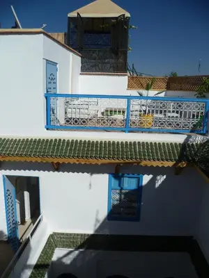 a view of a building with a blue balcony at Dar Daoud in Marrakech