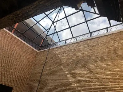 a window on the side of a brick building at Riad luna in Marrakech