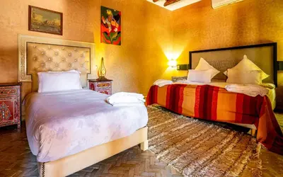 two beds in a room with two beds sidx sidx sidx sidx at Riad Citronnelle in Marrakech
