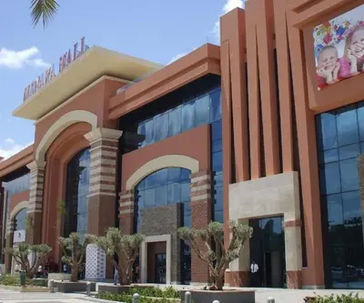 a large building with a building with two babies on it at Royal Deluxe Silver - Marrakech, Luxe Pool View in Marrakech