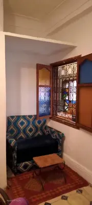 a living room with a couch and a window at Riad Dar Zaida in Marrakech