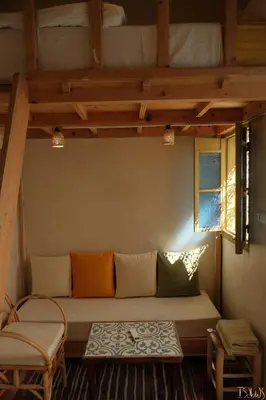 a living room with a couch and a window at Riad Yu Yu in Marrakech