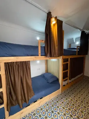 a couple of bunk beds in a room at Riad Yu Yu in Marrakech