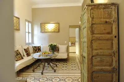 a living room with a couch and a table at Riad Home Zemrane in Marrakech