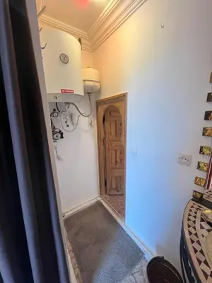 a room with a room with a door and a room with a room at Riad Palmier fleuri in Marrakech
