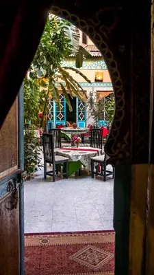 an outside view of a patio with a table and chairs at Riad Carole - Perfect for Families & Groups in Marrakech