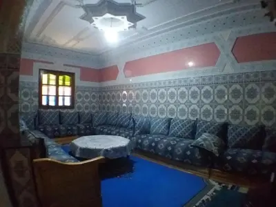 a living room with a couch and a table at House of Travelers in Marrakech in Marrakech