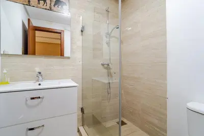 a bathroom with a shower and a sink at Cozy Atlas Golf Studio Prestigia Marrakech in Marrakech