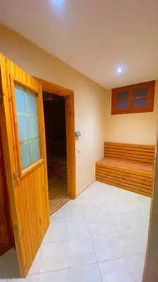 an empty room with a bed and an open door at Villa Marrakech in Marrakech