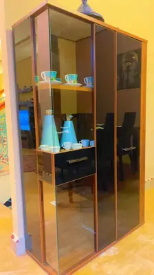 a glass cabinet with blue dishes in it at Villa Marrakech in Marrakech