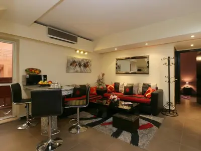 a living room with a couch and a table at Ghita Appartement in Marrakech
