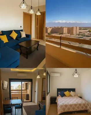 a room with a blue couch and a bed and a table at Appartement Nour 5 Marrakech Centre Gueliz avec piscine in Marrakech