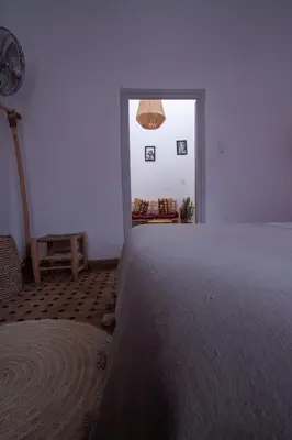 a bedroom with a large bed and a window at The Loft in Marrakech