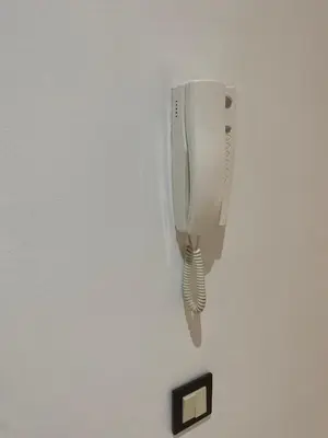 a white light hanging on a wall at Résidence Caprice Palace Hivernage in Marrakech