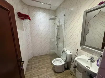 a bathroom with a toilet and a sink and a shower at Dar El Azzouzi in Marrakech