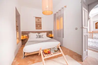 a bedroom with a large bed in a room at Riad Tizou in Marrakech