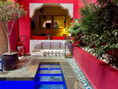 a house with a pool in the middle of a yard at Riad Hilmuna Hammam et Spa in Marrakech