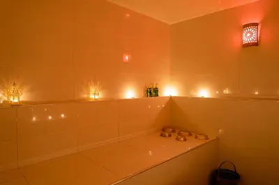 a bathroom with a tub with lights on it at Riad Dar Blanche & Spa in Marrakech