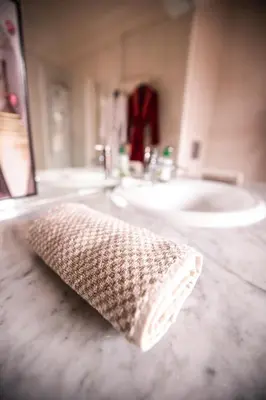 a bathroom with a sink and a towel on a counter at Cosy Villa Sabah With Private Pool in Marrakech