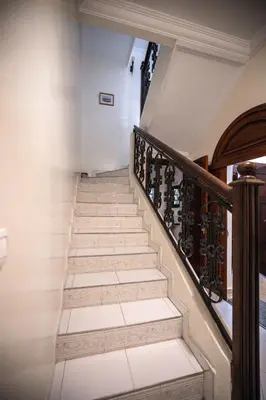 a staircase leading up to a house with white walls at Cosy Villa Sabah With Private Pool in Marrakech