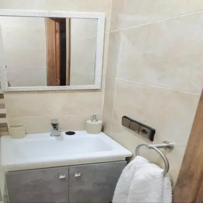 a bathroom with a sink and a mirror at appart Marrakech in Marrakech