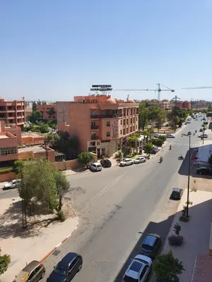 an aerial view of a city street with cars parked at Deluxe Apartment in Marrakesh. hevernage flat in Marrakech