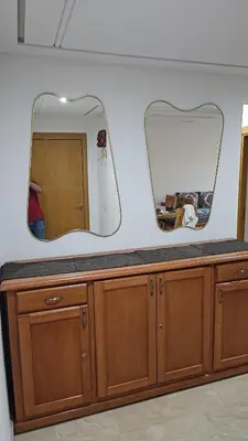 a counter with two mirrors on top of it at Deluxe Apartment in Marrakesh. hevernage flat in Marrakech