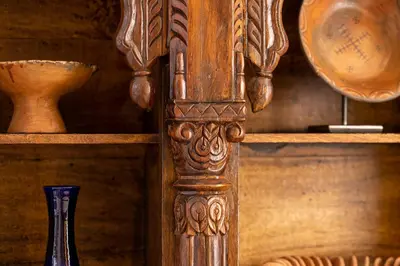 a wooden column with a vase on a shelf at Riad LAZ Mimoun & Spa in Marrakech