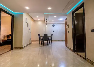a dining room with a table and chairs at Harmony Inn Entire 2 bedroom apartment in Marrakech
