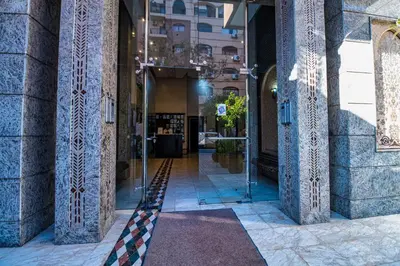 a hallway of a building with a glass door at Harmony Inn Entire 2 bedroom apartment in Marrakech