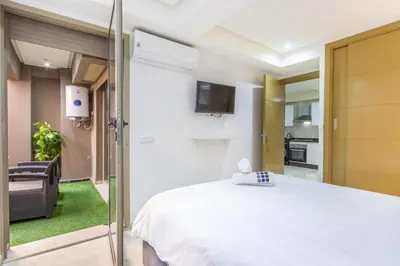 a bedroom with a bed and a sliding glass door at Relax, Modern, Centre Gueliz in Marrakech