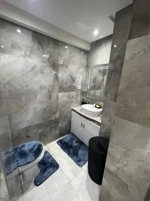 a bathroom with a toilet and a sink at PALACE B Av Hassan II Marrakech 40000 -Brand New Luxury UNIT#2 & UNIT#29 in Marrakech