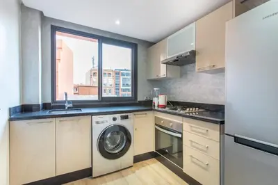 a kitchen with a washing machine and a window at New! Appartemant au millieu de guéliz in Marrakech