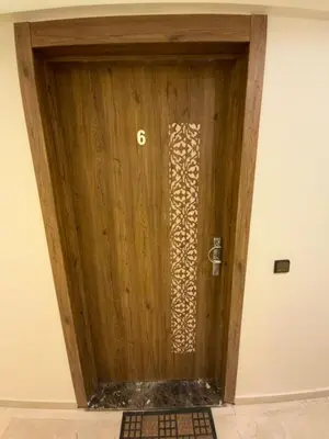 a wooden door with the number six on it at Best Appartement 3 BEDROOMS in Marrakech