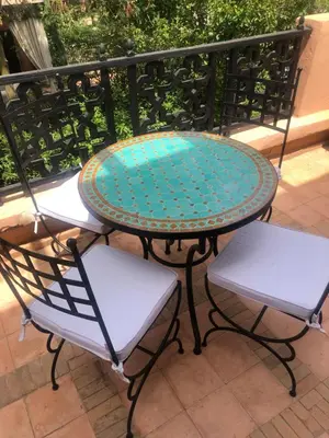 a table and two chairs on a balcony at Chez balqis atlas golf in Marrakech