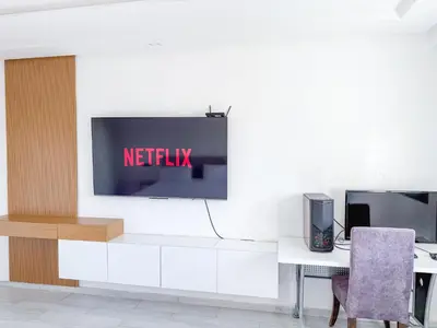 a living room with a tv on a wall at Villa piscine privée, Détente familiale Marrakech in Marrakech