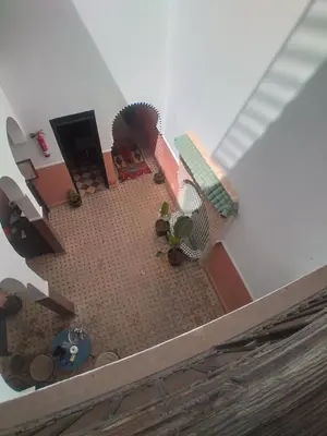 an overhead view of a living room with a floor at Riad 9 Derb El Bousnne in Marrakech